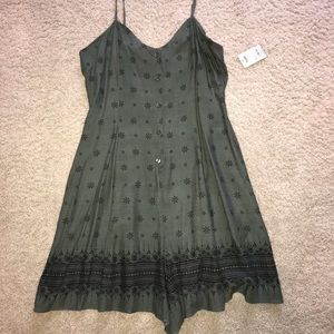 Green, button-up romper.